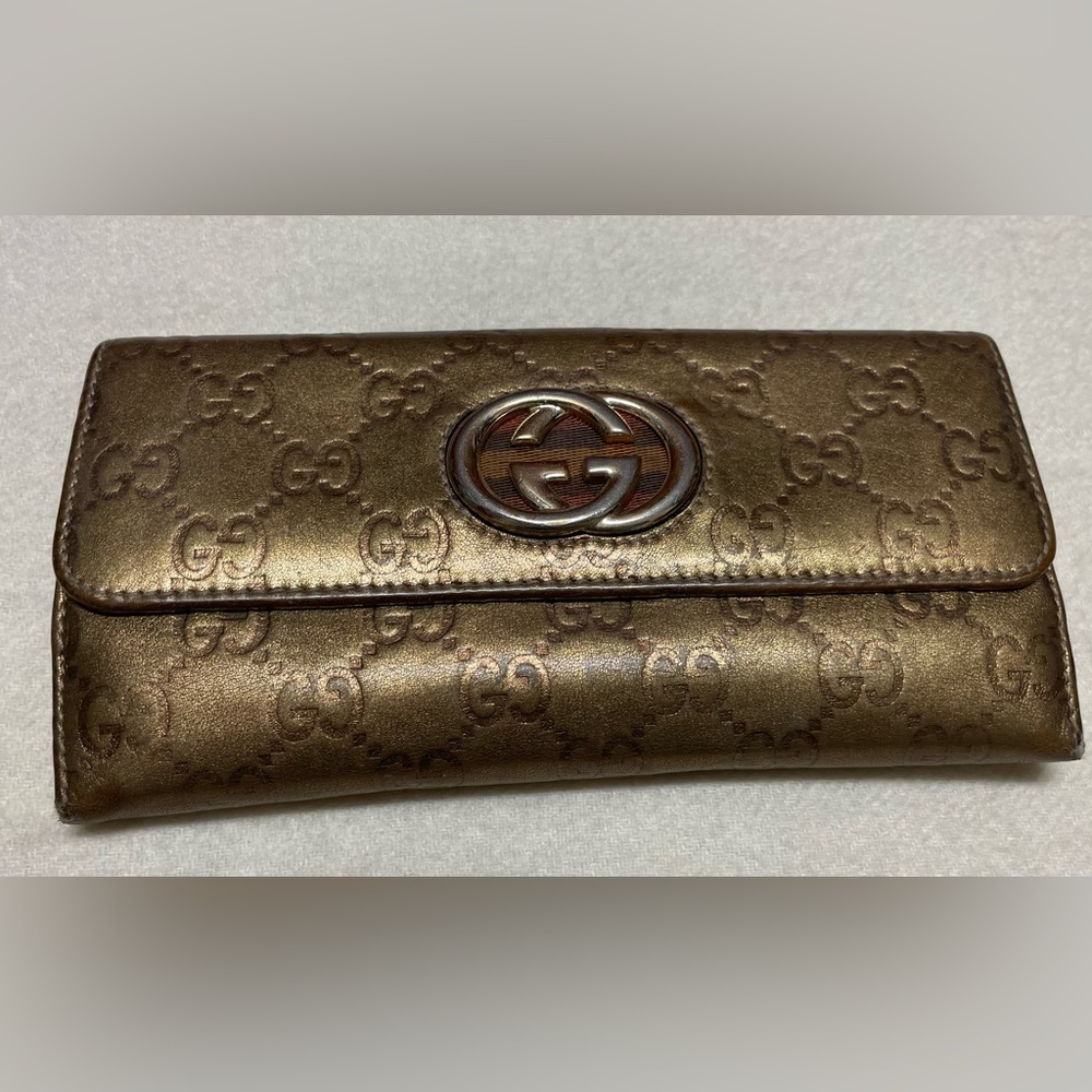 Authentic Gucci gold/bronze wallet made exclusively for Neiman Marcus 1907-2007.
